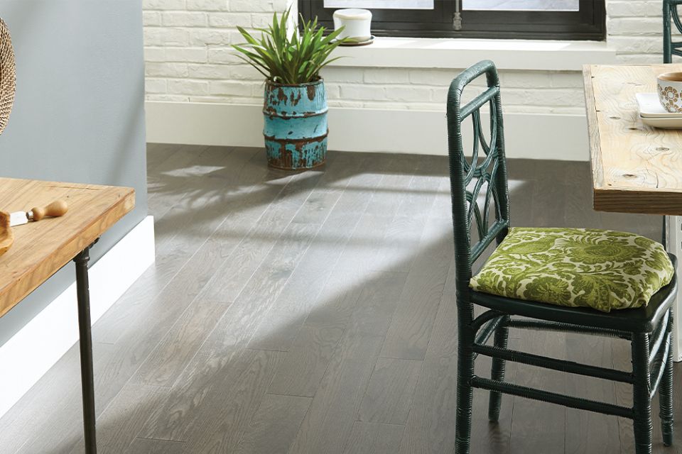 dark oak hardwood floors in a kitchen with green accents